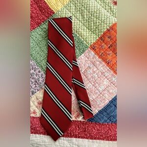 Men’s tie 100% Sturbridge silk red, white and blue stripes. Nice wearing tie.